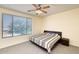 Spacious bedroom with a king-size bed and ceiling fan at 1404 W Weatherby Way, Chandler, AZ 85286