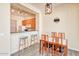 Dining area with wood table and chairs, kitchen view at 1404 W Weatherby Way, Chandler, AZ 85286