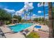 Community pool with lounge chairs and a spa at 1404 W Weatherby Way, Chandler, AZ 85286