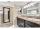 Double vanity bathroom with granite countertops at 1437 W Yukon Dr, Phoenix, AZ 85027