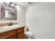 Bathroom features vanity, toilet and decorative mirror at 1437 W Yukon Dr, Phoenix, AZ 85027