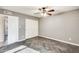 Bedroom with wood-look flooring and double door closet at 1437 W Yukon Dr, Phoenix, AZ 85027