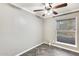 Bright bedroom featuring herringbone floors and ceiling fan at 1437 W Yukon Dr, Phoenix, AZ 85027