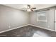 Spacious bedroom with wood-look flooring and ceiling fan at 1437 W Yukon Dr, Phoenix, AZ 85027