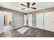 Bright bedroom with wood-look flooring and ceiling fan at 1437 W Yukon Dr, Phoenix, AZ 85027