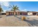 House exterior view with palm tree and desert landscaping at 1437 W Yukon Dr, Phoenix, AZ 85027