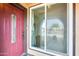 Red front door with glass panels and a sidelight window at 1437 W Yukon Dr, Phoenix, AZ 85027