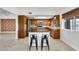 Modern kitchen with granite countertops and wood cabinets at 1437 W Yukon Dr, Phoenix, AZ 85027