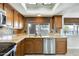 Kitchen with granite countertops, stainless steel sink and dishwasher at 1437 W Yukon Dr, Phoenix, AZ 85027