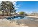 Relaxing backyard pool with stone accents and play area at 1437 W Yukon Dr, Phoenix, AZ 85027