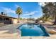 Relaxing backyard pool with a waterfall feature at 1437 W Yukon Dr, Phoenix, AZ 85027