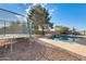 Inviting backyard pool with rock waterfall and trampoline at 1437 W Yukon Dr, Phoenix, AZ 85027