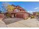 View of the home's exterior, highlighting the garage and landscaping at 16333 E Lombard Pl, Fountain Hills, AZ 85268