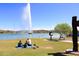 Gathering enjoys lake view with fountain in background at 16333 E Lombard Pl, Fountain Hills, AZ 85268