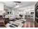 Open living area with hardwood floors, modern furniture, and a view into the kitchen at 16333 E Lombard Pl, Fountain Hills, AZ 85268