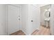 Powder room with pedestal sink and round mirror at 1702 E Bell Rd # 130, Phoenix, AZ 85022