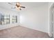 Bedroom with two large windows and ceiling fan at 1702 E Bell Rd # 130, Phoenix, AZ 85022