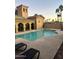 Community pool with lounge chairs and surrounding patio at 1702 E Bell Rd # 130, Phoenix, AZ 85022