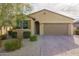 One-story house with a two-car garage and landscaped front yard at 17669 W Daley Ln, Surprise, AZ 85387