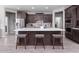 Modern kitchen with large island, stainless steel appliances, and ample cabinetry at 17669 W Daley Ln, Surprise, AZ 85387