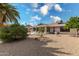 Backyard view with a bird bath and palm tree at 18003 N 136Th Way, Sun City West, AZ 85375