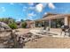 Spacious backyard with patio, fountain, and citrus trees at 18003 N 136Th Way, Sun City West, AZ 85375