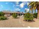 Landscaped backyard featuring a stone pathway and citrus trees at 18003 N 136Th Way, Sun City West, AZ 85375