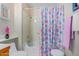 Clean bathroom with tub, shower, and seashell-themed decor at 18003 N 136Th Way, Sun City West, AZ 85375