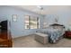 Bright bedroom featuring a comfortable bed and ample natural light at 18003 N 136Th Way, Sun City West, AZ 85375