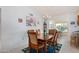 Bright dining area with a wooden table and chairs, offering ample space for meals at 18003 N 136Th Way, Sun City West, AZ 85375