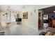 Open dining area with view into kitchen and sunroom at 18003 N 136Th Way, Sun City West, AZ 85375