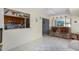 Kitchen features a breakfast bar and opens to dining area at 18003 N 136Th Way, Sun City West, AZ 85375