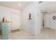 Bright and spacious entryway with tile flooring and a decorative shelf at 18003 N 136Th Way, Sun City West, AZ 85375