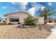 House exterior showcasing a well-maintained front yard and landscaping at 18003 N 136Th Way, Sun City West, AZ 85375