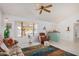 Living room showcasing a ceiling fan and comfortable seating arrangement at 18003 N 136Th Way, Sun City West, AZ 85375