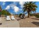 Relaxing patio area with lounge chairs and grill at 18003 N 136Th Way, Sun City West, AZ 85375