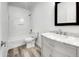 Bathroom with white vanity, bathtub and marble top at 2028 E Lipizzan Dr, San Tan Valley, AZ 85140