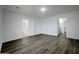 Main bedroom with wood-look floors and ensuite access at 2028 E Lipizzan Dr, San Tan Valley, AZ 85140