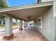 Spacious covered patio with ceiling fans and brick flooring at 2028 E Lipizzan Dr, San Tan Valley, AZ 85140