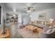 Open living room and kitchen with modern light fixtures at 2028 E Lipizzan Dr, San Tan Valley, AZ 85140