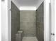 Large walk-in shower with gray tile and built-in seat at 2028 E Lipizzan Dr, San Tan Valley, AZ 85140