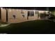 Night view of backyard with patio, string lights, and swings at 2032 E Pegasus Dr, Tempe, AZ 85283