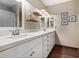 Bathroom with double vanity, white cabinets, and quartz countertops at 2032 E Pegasus Dr, Tempe, AZ 85283