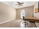 Bright bedroom with carpeted floor, built-in desk, and window shutters at 2032 E Pegasus Dr, Tempe, AZ 85283