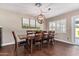 Elegant dining room with wood table and six chairs at 2032 E Pegasus Dr, Tempe, AZ 85283