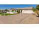 Bright white brick home with two-car garage and driveway at 2032 E Pegasus Dr, Tempe, AZ 85283