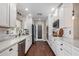 Modern kitchen with white cabinets and quartz countertops at 2032 E Pegasus Dr, Tempe, AZ 85283