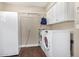 Clean laundry room featuring washer, dryer, and additional storage at 2032 E Pegasus Dr, Tempe, AZ 85283