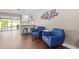 Bright and airy living room with two blue armchairs at 2032 E Pegasus Dr, Tempe, AZ 85283