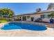 Large kidney-shaped pool with flagstone patio at 2032 E Pegasus Dr, Tempe, AZ 85283